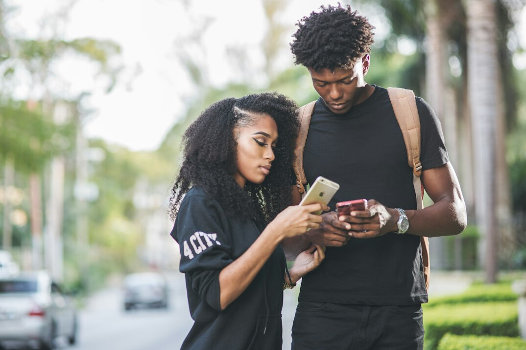 couple looking at phones together